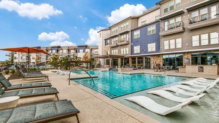 Resort-inspired pool with sundeck and tanning ledge