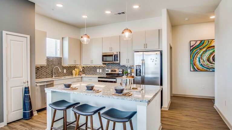 Bright kitchen with island and bar seating