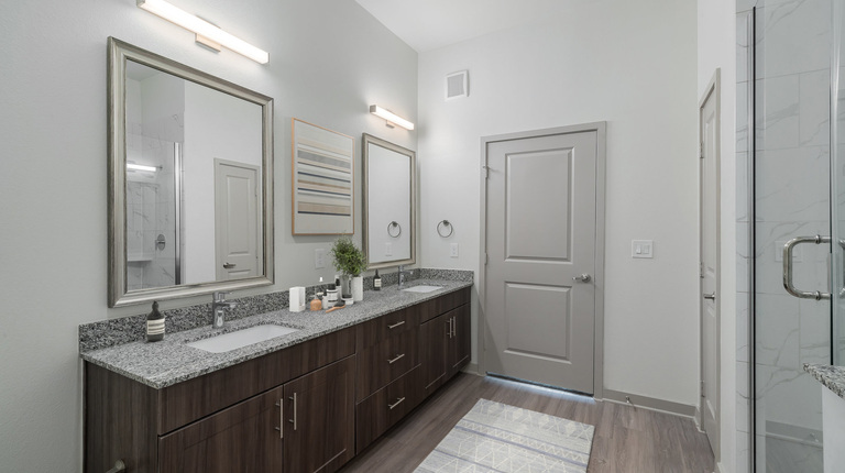 Spacious bathroom with double-vanity and walk-In shower